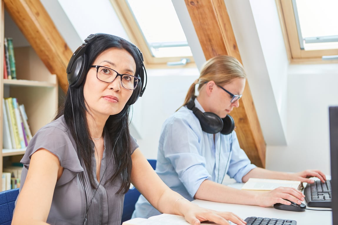 Young Asian Woman at E-Learning Language Course