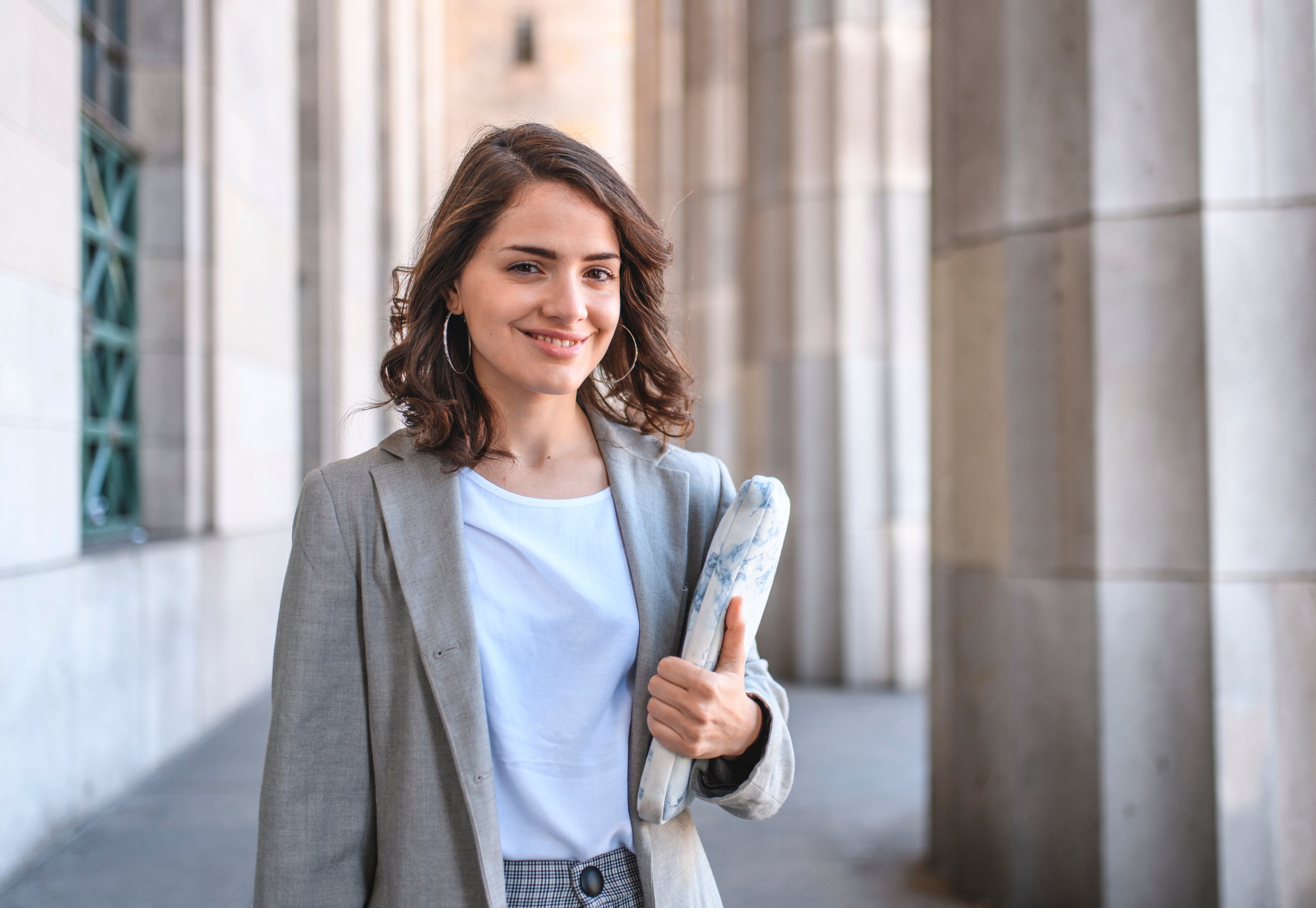 Young Female Law Student Leaving University Building